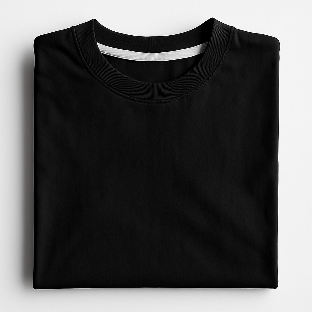 Folded black t-shirt on a light gray background