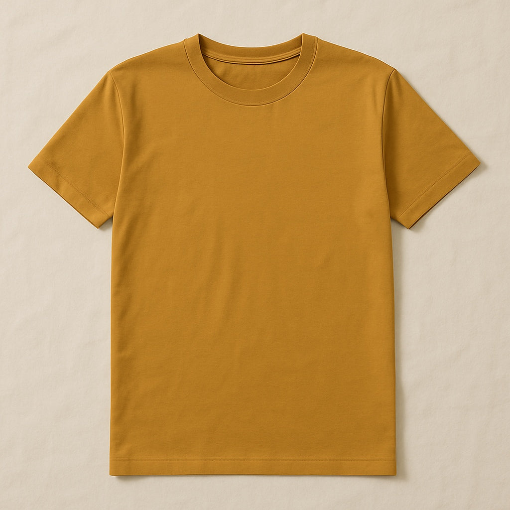 Plain mustard yellow t-shirt on a beige background