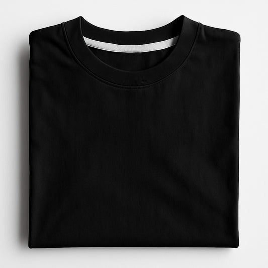 Folded black t-shirt on a light gray background