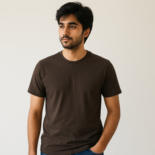 Man wearing a brown t-shirt against a plain background