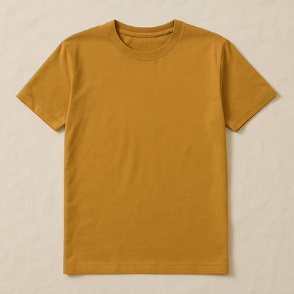 Plain mustard yellow t-shirt on a beige background