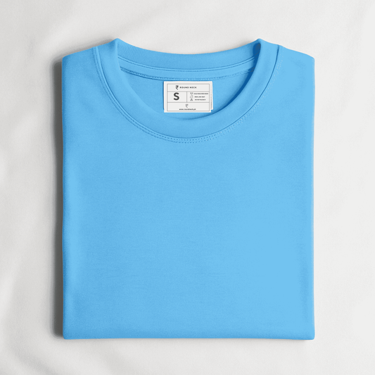 Folded light blue t-shirt with a size label on a light gray background