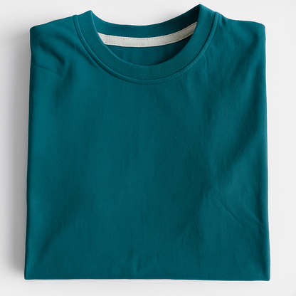 Folded teal t-shirt on a light gray background